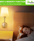 Set Of Two Wireless Wall Sconces With Rechargeable Dimmable Led Bulbs And Remote Control delivering warm light above a bed.