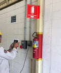 Two Pack 6x6 Acrylic Fire Extinguisher Sign With Down Arrow, UV Protected And Fade Resistant, installed in indoor setting next to extinguisher.