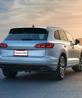SUV with Rose Pattern License Plate Frames 2 Pack Aluminum Car Plate Covers in sunset setting, rear view, universal fit