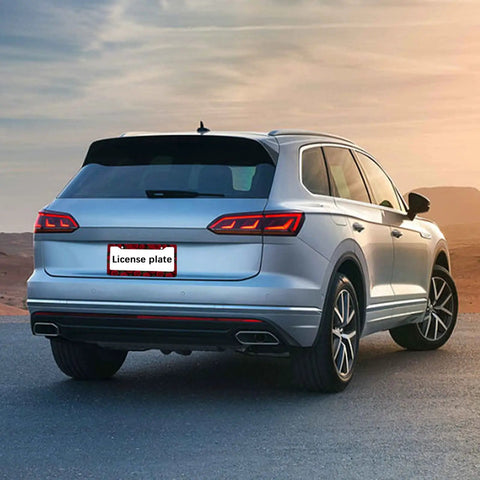 SUV with Rose Pattern License Plate Frames 2 Pack Aluminum Car Plate Covers in sunset setting, rear view, universal fit