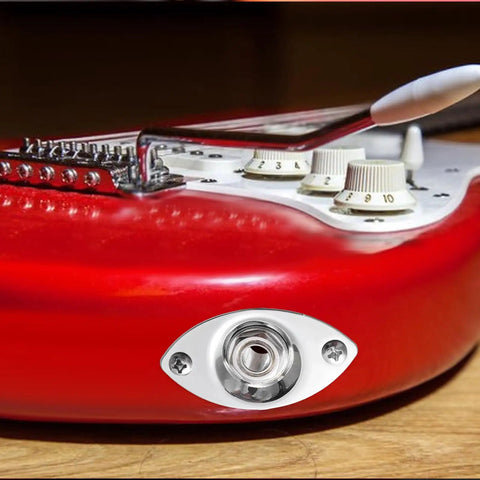 Killer Electric Guitar Output Jack Plate With Quarter Inch Connector and Two Mounting Screws on red guitar body