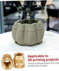 3D printer creating part with One Fourth Threaded Brass Knurled Heat Set Inserts Kit in foreground, 30 pack, for plastic projects.