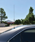 Pretuned Dual-Band Ham Radio Antenna Kit 144 148 MHz VHF And 440 450 MHz UHF installed on car roof in outdoor setting