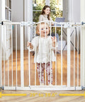 Adjustable Baby Gate For Pets 29 To 39.6 Inches Wide, 30 Inch Tall, auto-close feature, child standing behind gate