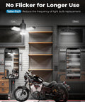 Beast Mode 8000LM Motion Sensor Garage Light With 360 Degree Detection And 3 Switch Modes 6500K Cool White LED Indoor Light Bulb lit garage setup with motorcycle.