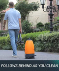 Man walking with Beast Cordless Portable Pressure Washer With 22L Tank And 12000mAh Battery on stone path