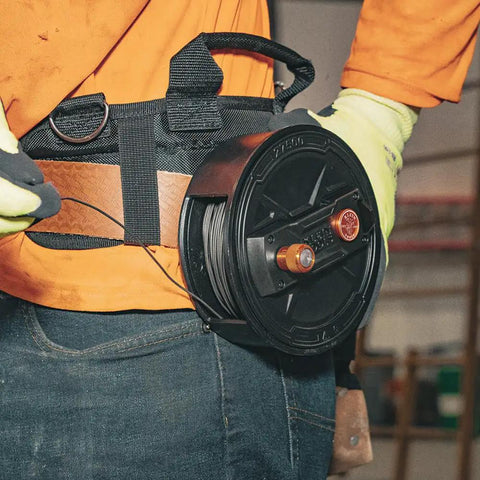 Tie Wire Reel With Quick Lock And Lightweight Aluminum Body on work belt, ambidextrous rewind knob, fits 12 to 18 gauge wire.