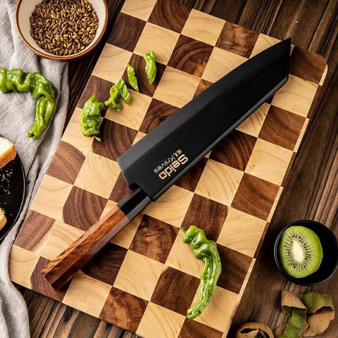 Kiritsuke Knife Cover With Walnut Magnetic Sheath For 10 Inch Blades on cutting board with green peppers and kiwi