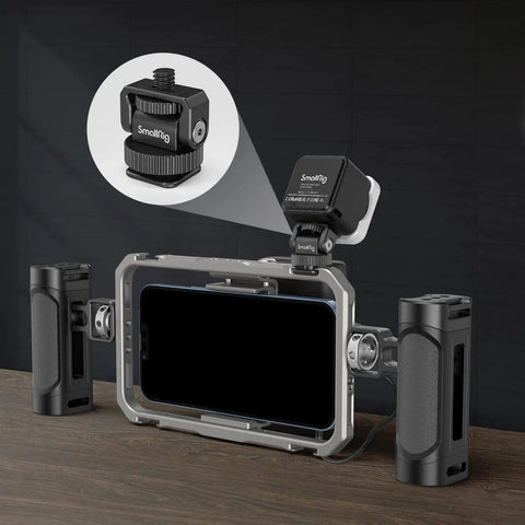 Lightweight Mini Ball Head Cold Shoe Mount Adapter With Quarter Inch 20 Thread attached to camera cage for LED video light setup.