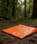 Orange sheet on forest path, unrelated to Heavy Duty Cart Liner Bag For Street Sweepers And Utility Carts Waterproof Oxford Cloth.