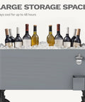 80 Quart Outdoor Rolling Ice Chest Wagon Cooler Cart With XL Wheels filled with bottles on ice for beach patio and parties.