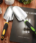 Two Pack Garden Trowel Hand Shovel Set With Soft Rubberized Non Slip Handle Aluminum Alloy Potting Shovel For Digging And Planting Comfortable Grip Lightweight Weed Tools In Yellow And Green Must Have Garden Tool Kit resting on a table