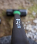 Close-up of 16 Lb Sledge Hammer With Beefy Heavy Duty Build, No Slip H Grip Handle, Fiberglass Core on ground