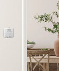 CT30A1005 Heat Only Manual Economy Thermostat Almond Finish 0.6 In low voltage control on wall in cozy room setting.