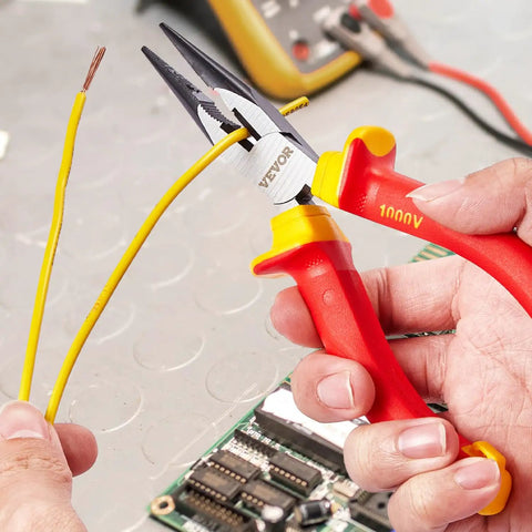 Top Shelf 12 Piece Insulated Screwdriver Set For Pro Electricians Featuring Badass Magnetic Phillips Slotted Tips 1000V Vde Certified Tools With Heavy Duty Insulated Pliers And Cutters, close-up of insulated pliers cutting yellow wire.