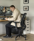 Office chair featuring Rollerblade Casters 3 Inch 11x22mm All Black Set Of 15 in a home office setting.