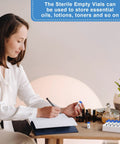20 pcs 2ml sealed sterile glass vials with blue caps, laid on a desk beside label stickers
