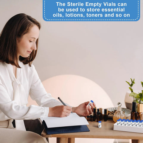 20 pcs 2ml sealed sterile glass vials with blue caps, laid on a desk beside label stickers