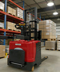 Solid Electric Pallet Stack Truck For Warehouse Inventory Control With Heavy Duty Lift Arms positioned in a warehouse aisle.