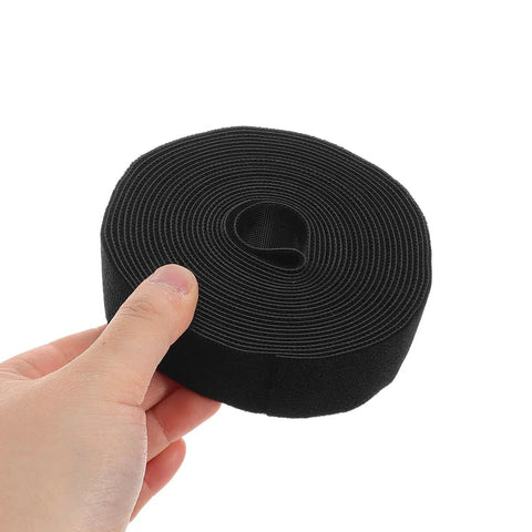 Reusable Black Polyester Cable Ties For Desk Wire Management Heavy Duty Cord Straps For Computer Setup Electronic Organizer held in hand