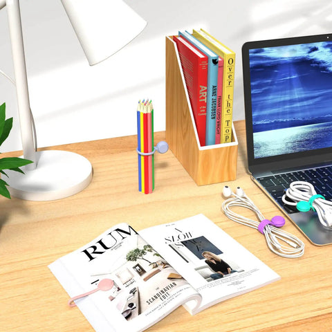 Office desk with Magnetic Cable Ties 10 Pack Reusable Cable Organizers for earbuds and cords USB cables cable manager by lamp and books