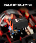 Pulsar optical switch featured in a close-up view against a blurred gaming mouse background, emphasizing precision components.