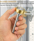 Hand holding 12 Pack Built Tough Heavy Duty Truck Trailer Door Rollers Replacement Parts For Box Trucks And Commercial Vehicles, Seven Sixteen Inch Diameter By Two And Three Quarters Inch Long Rod, Steel Wheel Rollers.