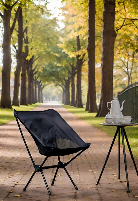 Lightweight Foldable Camping Chair With Grab And Go Carry Bag For Hiking And Outdoors, Sturdy Oxford Frame beside outdoor table