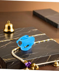 5 Piece Hollow Out Pigeon Injection Holder With Buckle Stable Fixation Feeder Rack on marble surface with gold bells