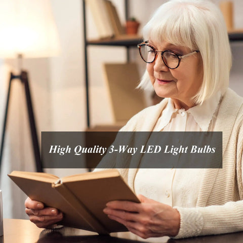 Person reading under A21 LED Three Way Light Bulb With Low Medium High Settings, 2200 Lumens Daylight 5000K, 4 Pack