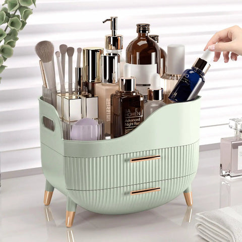 Slick Green Makeup Organizer With Two Deep Drawers And Sturdy Carry Handle, Large Skincare Storage Box on a vanity, filled with cosmetics.