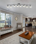 Dope Flexible Track Lighting Fixture With Foldable Arm And Eight Adjustable GU10 Heads in living room ceiling setup.