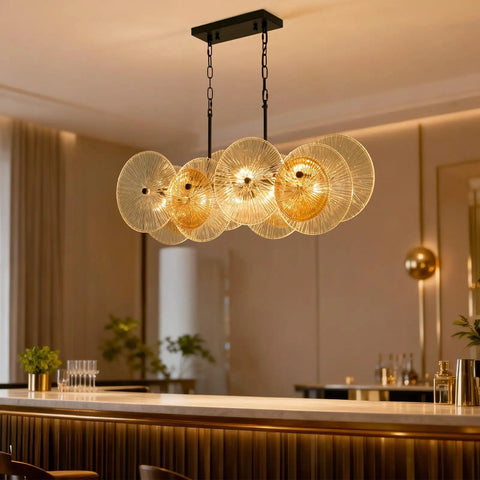Modern chandelier above dining table in elegant room, 4-light design with black metal and exposed bulbs, setting a cozy vibe.