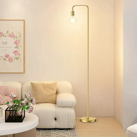 Industrial Floor Lamp With Light Bulb Included, Tall Metal Standing Light In Brushed Gold in a modern living room setting
