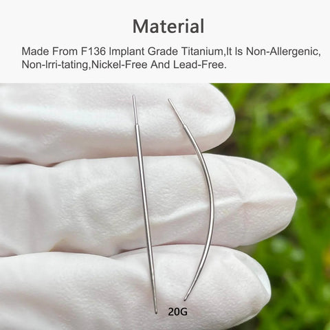 Close-up of 20G curved and straight titanium threadless piercing tapers held by gloved hand, highlighting F136 implant grade material.