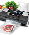 Beast 95KPa Vacuum Sealer Machine For Home Cooks And Pros with steak, bags, and cutter in black silver color.