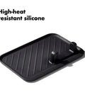 Silicone tool rest from Three Piece Grilling Tool Set With Stainless Steel Turner Scalloped Tongs And Silicone Tool Rest Built In Bottle Opener Non Slip Grip And Tong Holder Designed For One Handed Use With Extra Leverage From A Double Bend.
