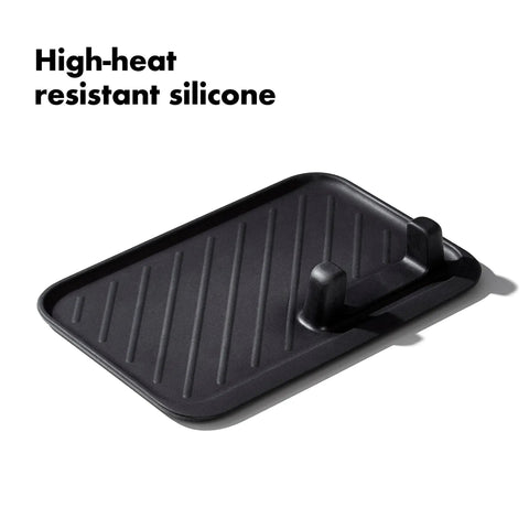 Silicone tool rest from Three Piece Grilling Tool Set With Stainless Steel Turner Scalloped Tongs And Silicone Tool Rest Built In Bottle Opener Non Slip Grip And Tong Holder Designed For One Handed Use With Extra Leverage From A Double Bend.