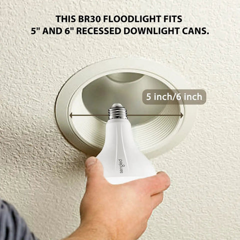 Hand holding BR30 Zigbee Smart Bulbs 6 Pack Dimmable Flood Light Soft White 2700K showing recessed fixture fitting