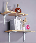 Rock Solid White Heavy Duty L Brackets For Wall Shelves 8 By 6 Inch Thick Steel Shelf Support holding decor and books.