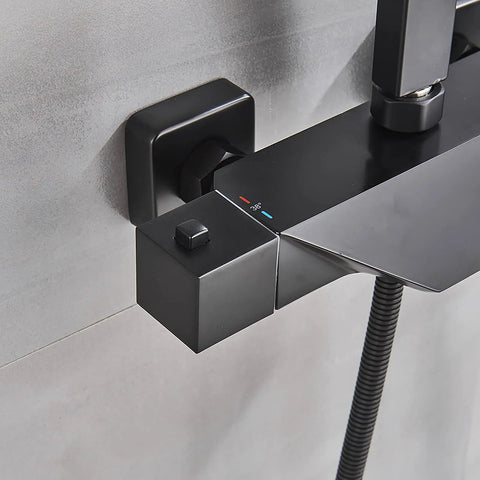 Close-up view of UMJIGF 8 Inch Black Shower System Thermostatic Waterfall Shower Faucet Set control panel with temperature indicators.