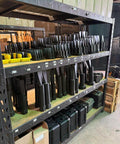 Pair Of 3/4 Inch Flange Alignment Pins In Black 4140 Steel Heat Treated For Heavy Duty Misalignment Fix stacked on warehouse shelves