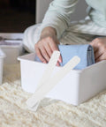 Hands organizing clothes with Heavy Duty Drawer Slides 2 Pack Smooth Operation White Plastic Rails for Wardrobe and Cabinet