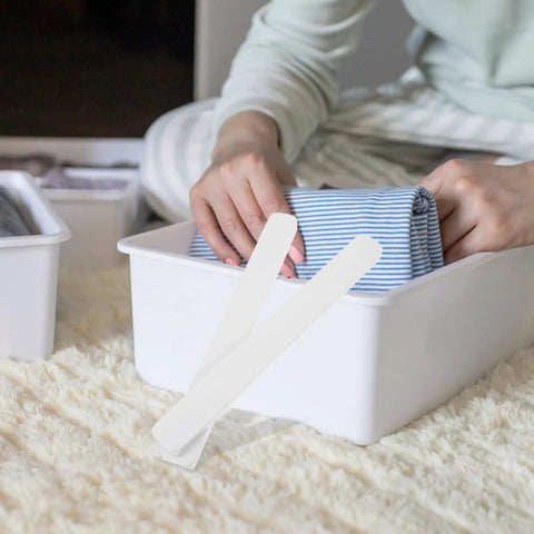 Hands organizing clothes with Heavy Duty Drawer Slides 2 Pack Smooth Operation White Plastic Rails for Wardrobe and Cabinet