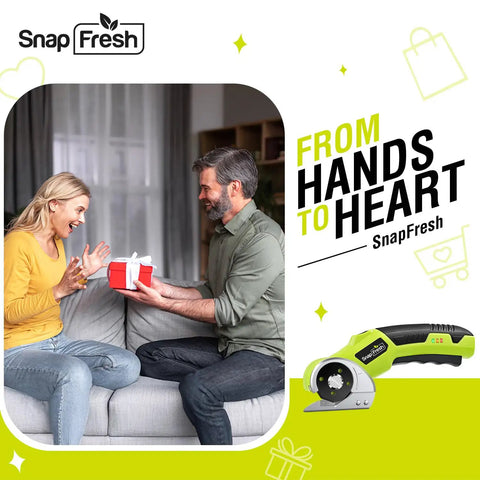 SnapFresh Cordless Electric Scissors With Rechargeable Battery And Self-Sharpening Blades For Cutting Cardboard Fabric Leather Carpet on a couch with a gift.