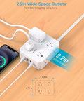 Plug Away With This Slick Flat Surge Protector Power Strip Featuring Eight Roomy Ac Outlets And Four Fast Usb Ports To Charge All Your Gear Smoothly Without Cluttering Your Desk Or Emptying Your Wallet on a wood desk with phone and adapters.