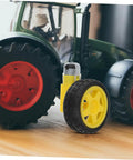 Electric Motor And Plastic Tire Wheel Set For RC Cars And Trucks, Easy Assembly Axles For Robot Car Builds, shown with toy tractor.