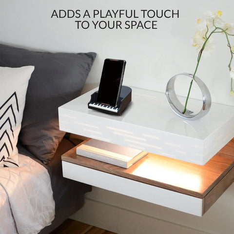 Sturdy Piano Phone Stand For Desk And Bedside Holder That Grips Up To 8 Cm Wide Phones on a modern nightstand with decor