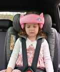 Child asleep in car seat with Kids Car Seat Head Support Band For Safe Travel, Adjustable Baby Neck Pillow, pink with cartoon pattern.