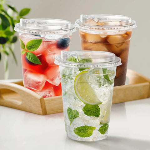 16 Oz Clear Plastic Cups With Lids 50 Pack For Iced Coffee And Cold Drinks Strawless Sip Lids Perfect For Parties Outdoors Office Events Disposable Cups holding iced beverages on tray